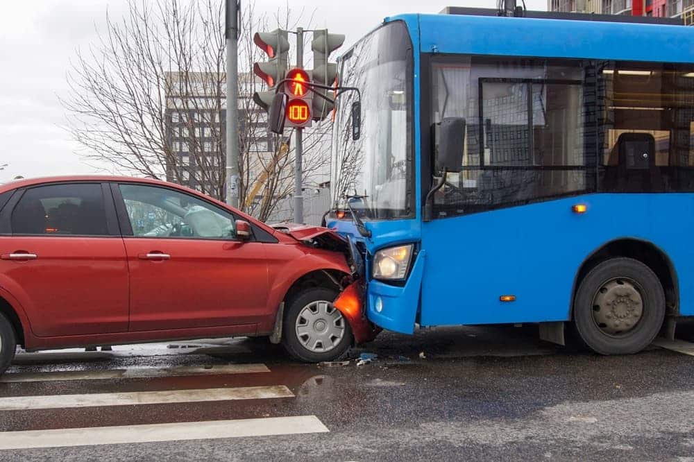 A Bus and Car collision on the road