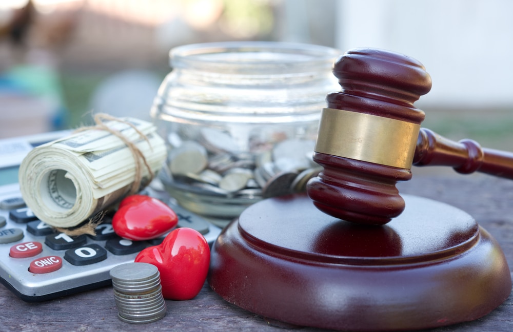 Gavel and coins symbolizing personal injury lawsuit costs