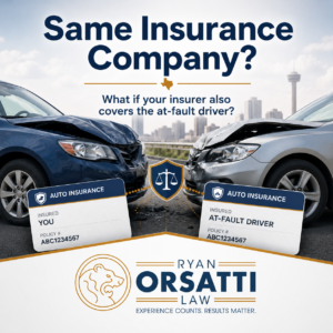 Insurance adjuster reviewing two claim files for drivers insured by the same company after a Texas crash